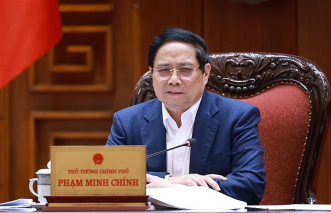 찐 총리가 회의에서 발언하고 있다. (사진: VNA)