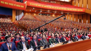 21일 제14차 전국당대회 대회장에 모인 대의원들. (사진: VNA)