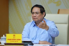 팜 민 찐 베트남 총리가 회의에서 연설하고 있다. (사진: VNA)